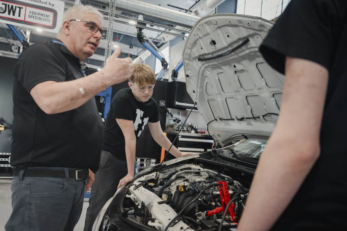 Students at Father Judge get instruction on auto technology.