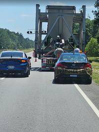 State patrol with semi and spotter car.png