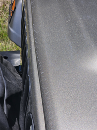 Paint damage to hood lip.png